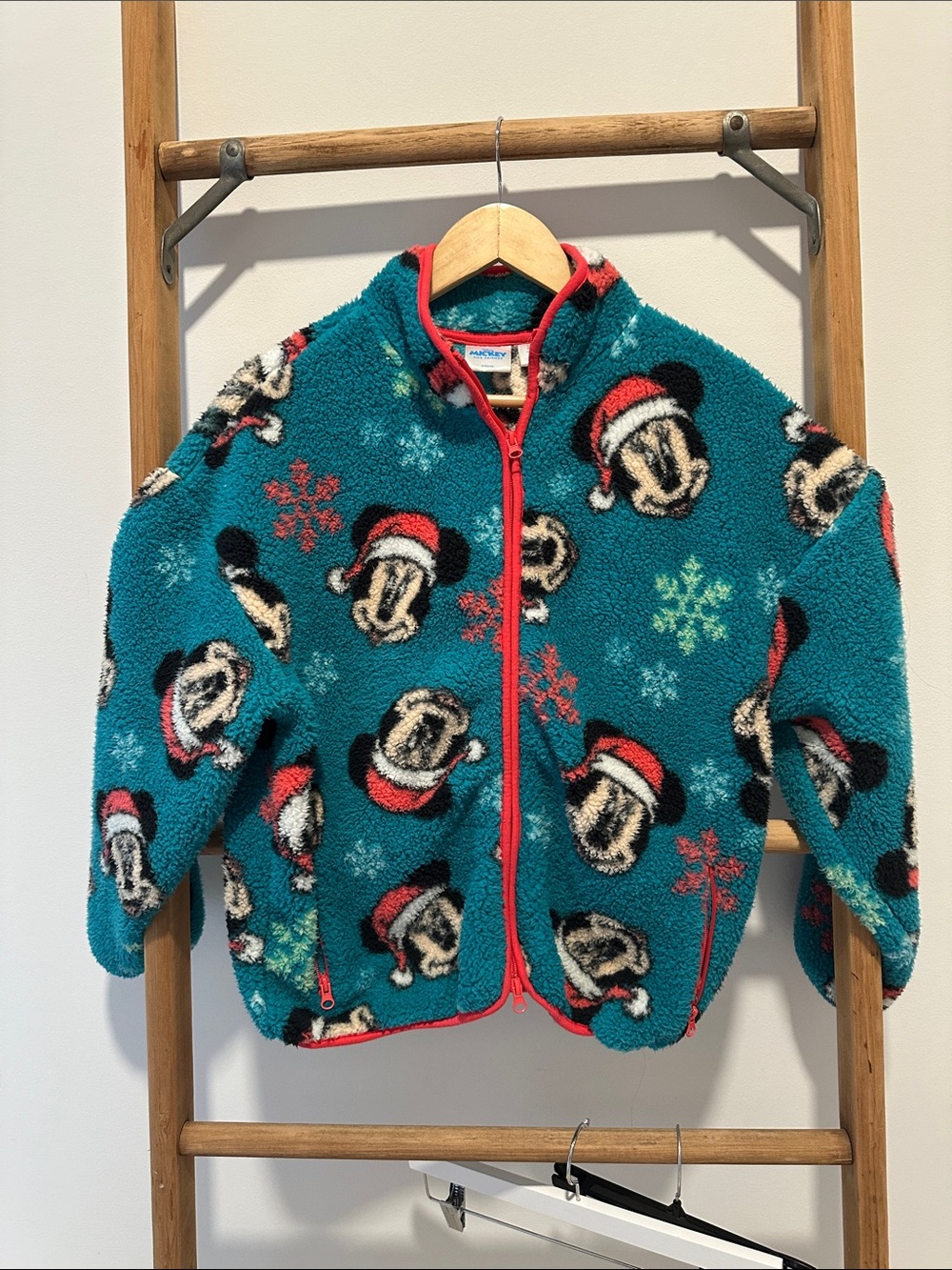 Disney women’s Teal Teddy Jacket with Red Trim and Mickey Holiday Print